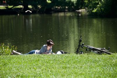 Men lying in lake