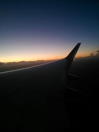 Cropped image of airplane wing