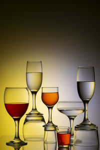 Glassware of different sizes against colorful background