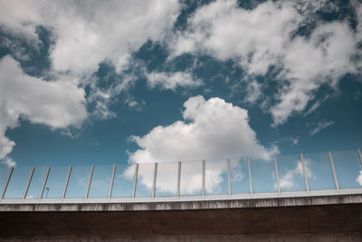 Low angle view of building against cloudy sky