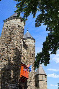 Low angle view of old ruins against sky