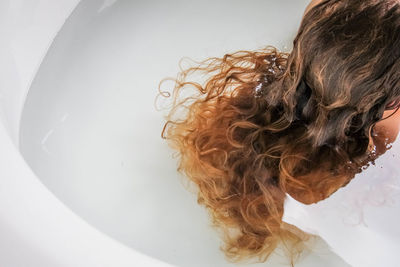 Woman with hair in water