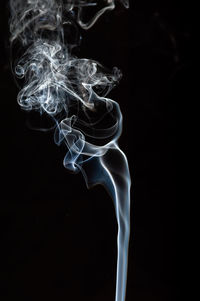 Close-up of smoke against black background