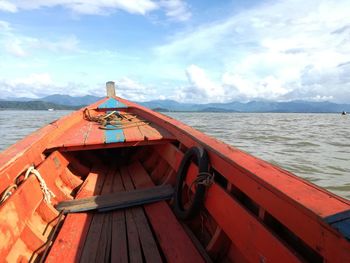 Boat sailing on sea against sky