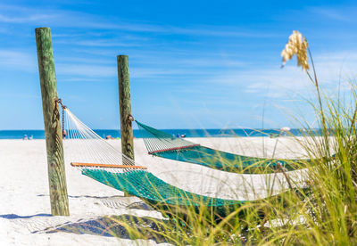 Scenic view of beach against blue sky