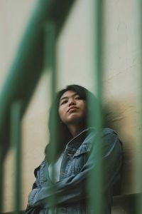 Portrait of beautiful young woman in city