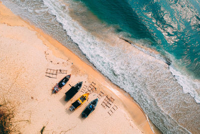 Aerial view of boats moored at beach