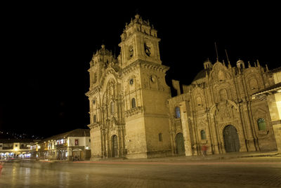 Low angle view of illuminated building at night