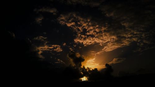 Low angle view of dramatic sky at sunset
