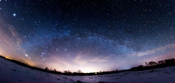 Low angle view of starry sky at dusk