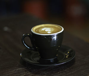 Hot cappuccino is served on the table