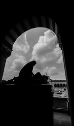 Low angle view of building against cloudy sky