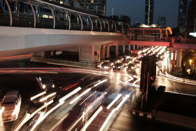 Light trails on road in city at night