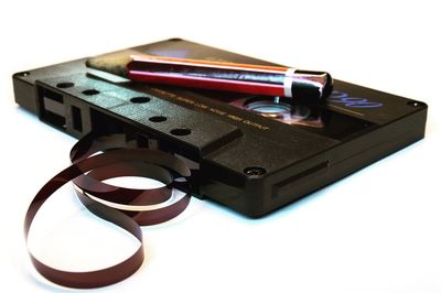 High angle view of camera on table against white background