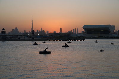 View of buildings in city during sunset