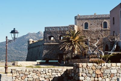 Old building against clear blue sky