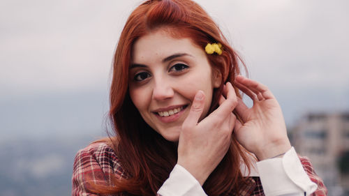 Young girl celebrates women's day with yellow mimosa flowers in hand