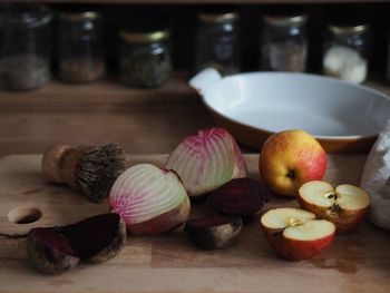 Close-up of vegetables and fruits on cutting board