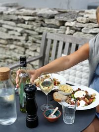 Midsection of man having food on table