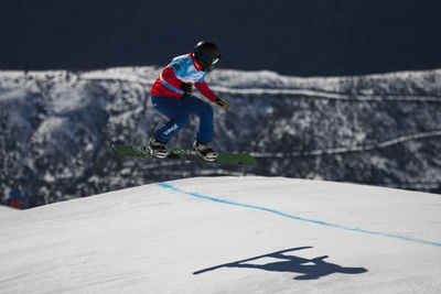 Man jumping in snow