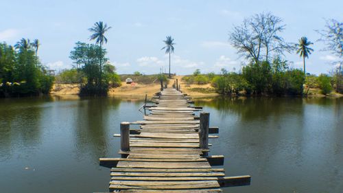 Wooden jetty leading to lake