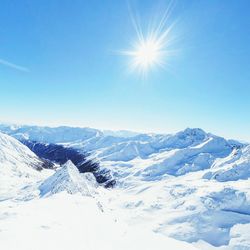 Scenic view of snow covered mountains