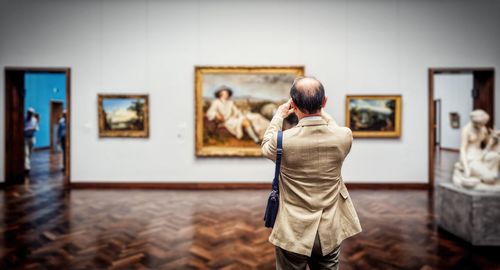 Rear view of woman in museum