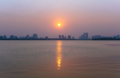 Scenic view of sea against sky during sunset