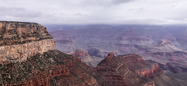 Aerial view of landscape with mountain range in background