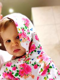 Close-up portrait of cute girl at home