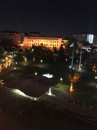 High angle view of illuminated buildings in city at night