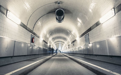 Illuminated tunnel at subway station