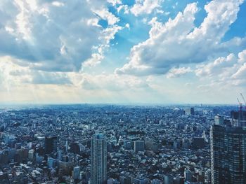 High angle view of tokyo cityscape against cloudy sky