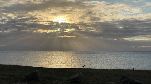 Scenic view of sea against sky during sunset