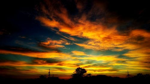 Low angle view of dramatic sky during sunset