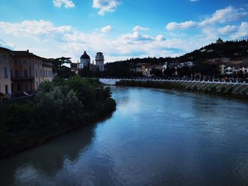 River amidst buildings against sky