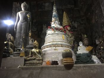 Low angle view of buddha statue against temple