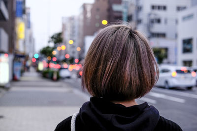 Rear view of woman on street