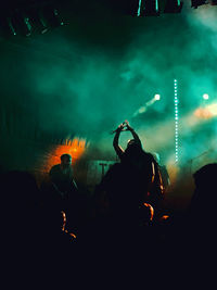 Silhouette people at music concert