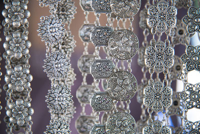 Close-up of silver jewelry hanging for sale