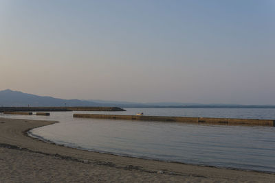 Scenic view of sea against clear sky during sunset