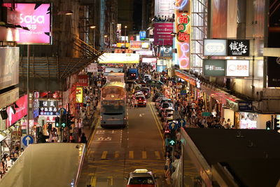 People on street in illuminated at night