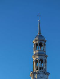 Low angle view of building against clear blue sky