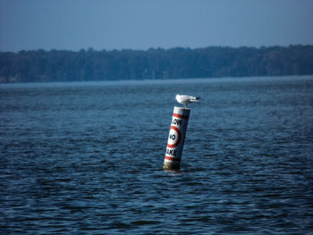 Close-up of boat in lake against sky