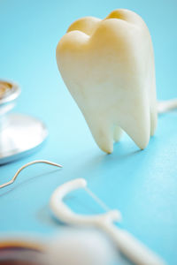 Close-up of spoon over white background