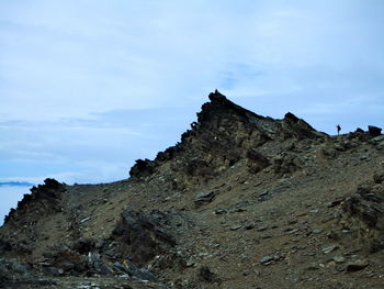 Low angle view of rock formation against sky
