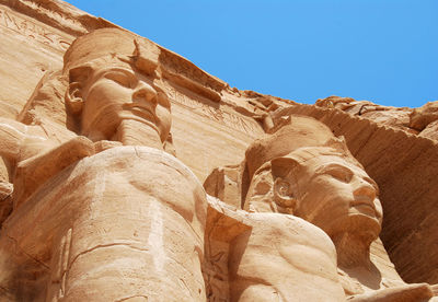 Low angle view of rock formation against sky