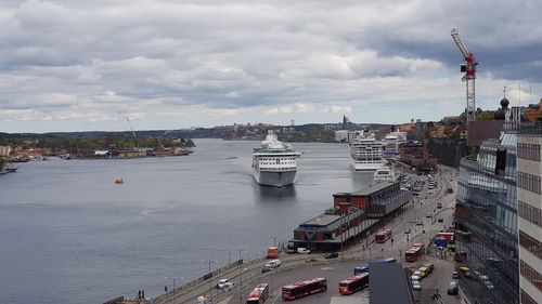 High angle view of commercial dock by sea against sky