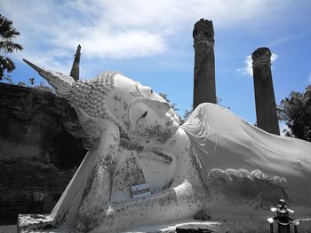 Low angle view of statue against building