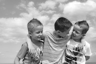 Portrait of three brothers in black and white